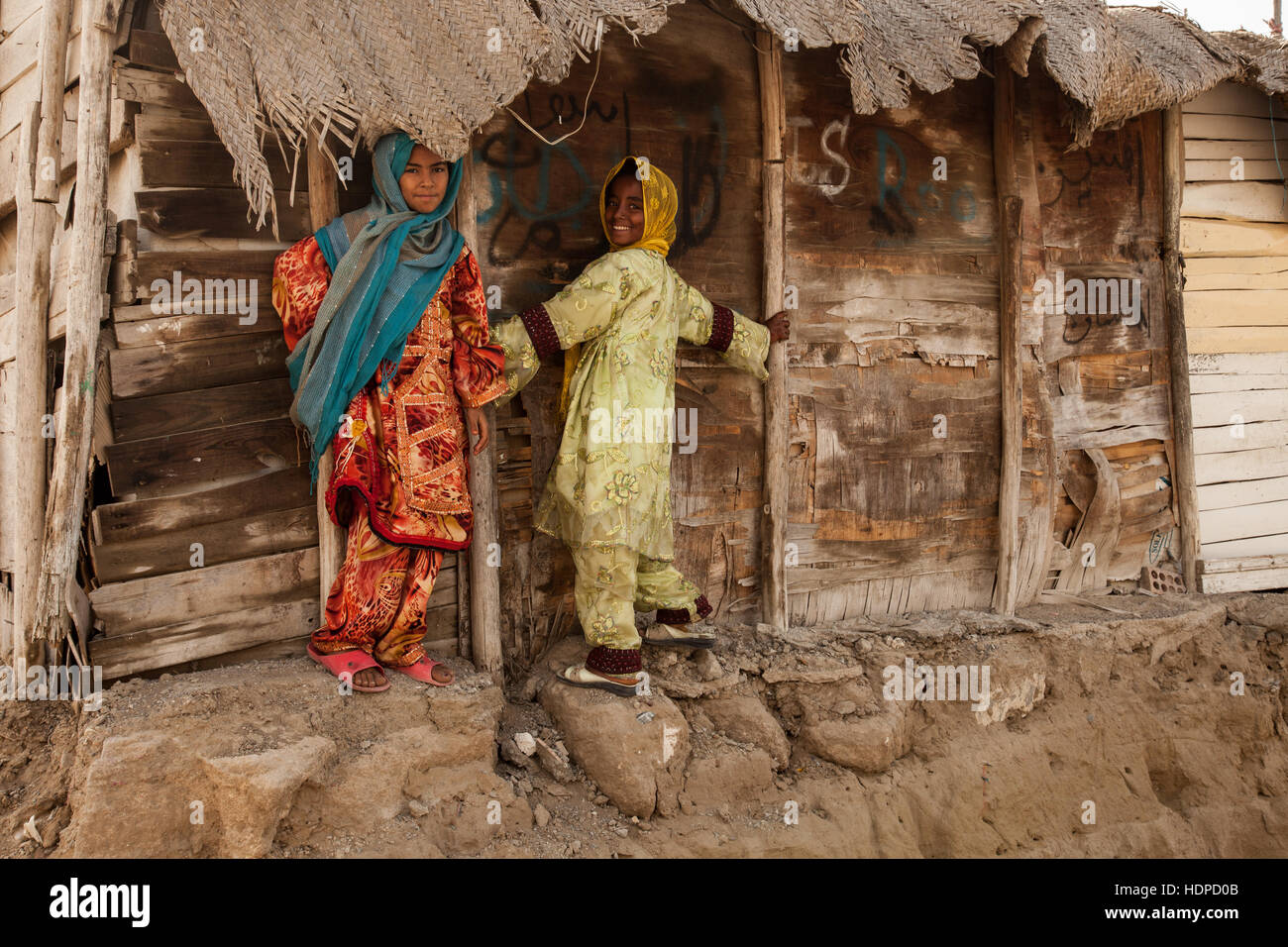 This is the story about two girls who are seller in small town and this  house hand made is by wood and sometimes are by plastics Stock Photo - Alamy