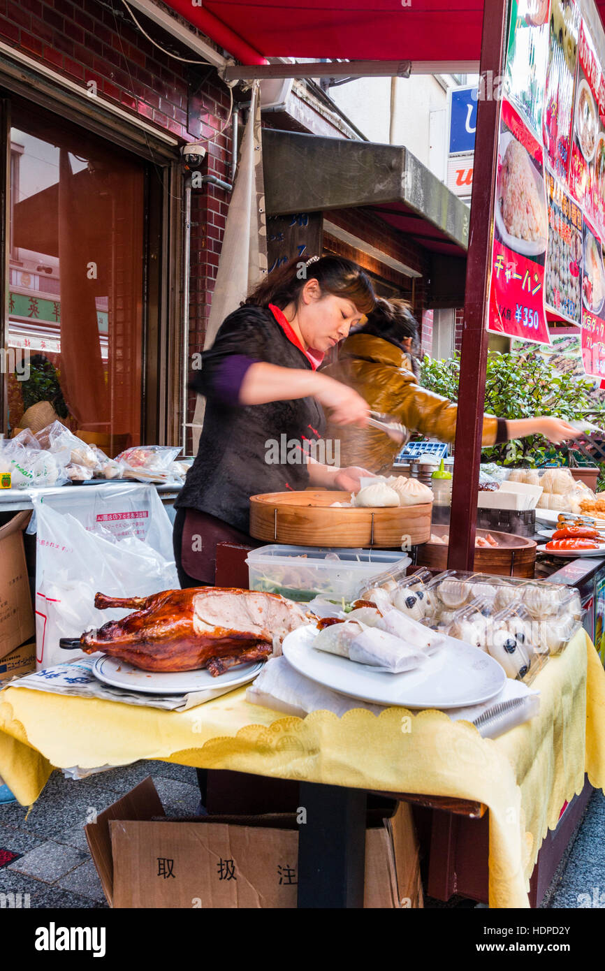 Japan, Kobe, Nankinmachi, Chinatown. Chinese food stall counter with