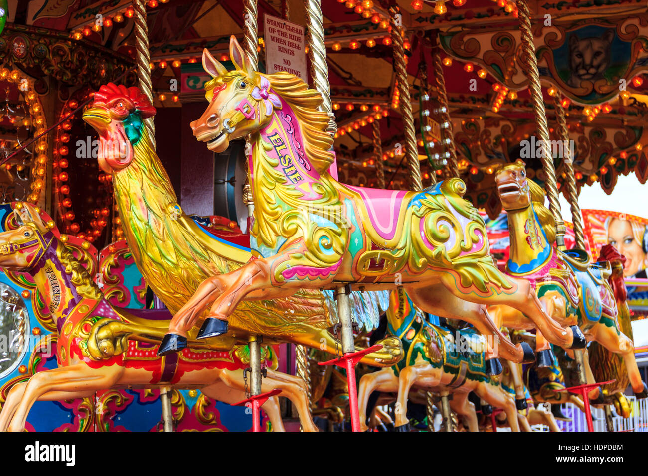 Fairground horses on a traditional carousel at an Easter Bank Holiday fair, London, UK Stock Photo