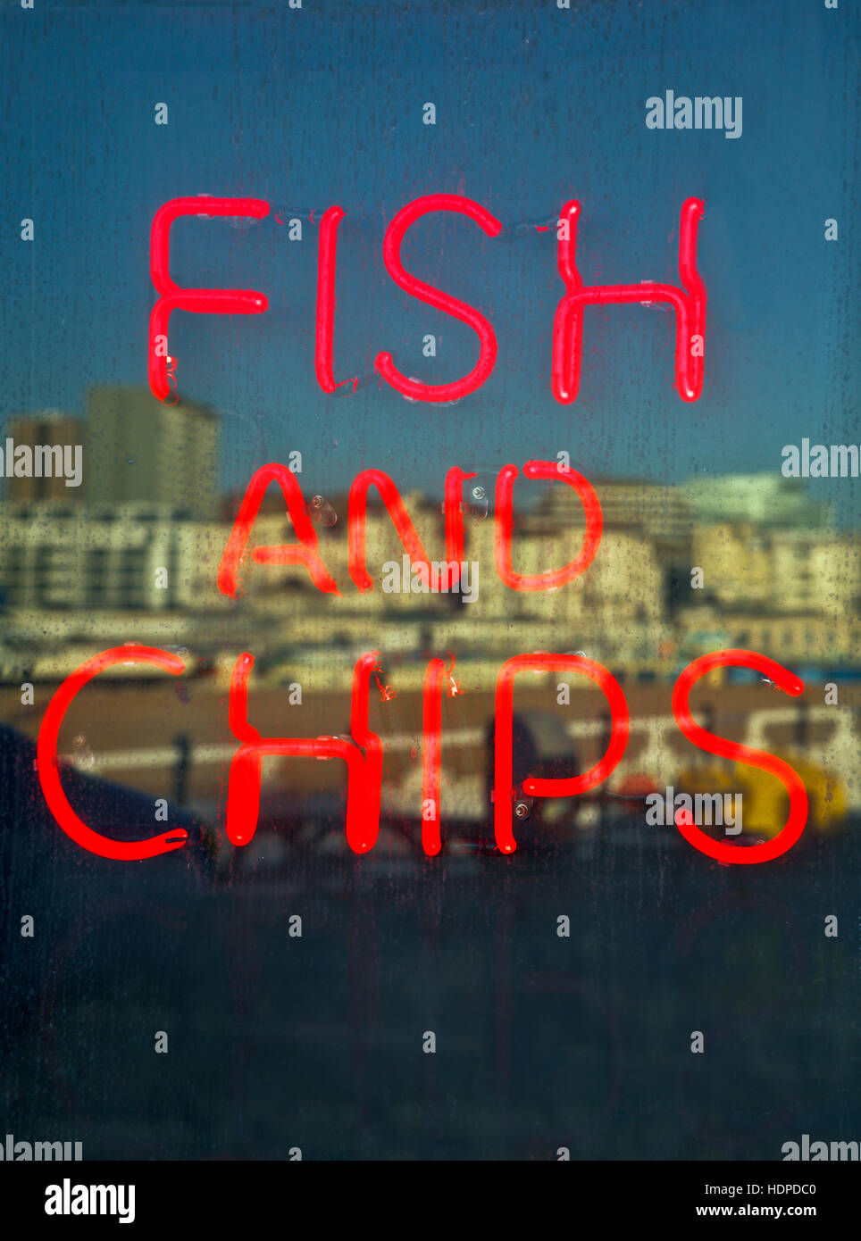 Neon fish and chips sign. Stock Photo