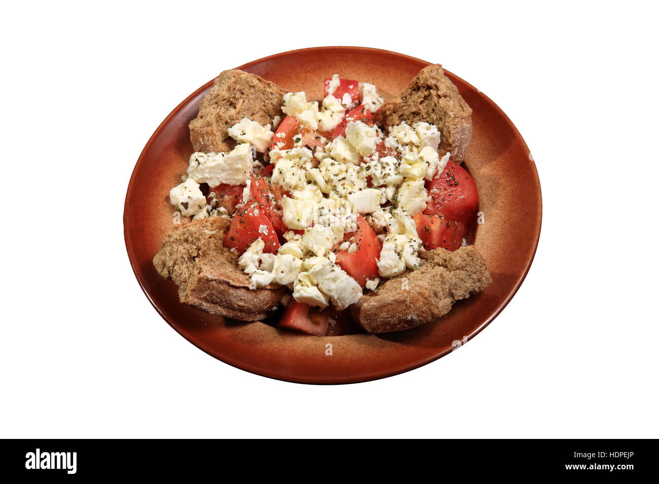 salad with feta cheese and tomato served on a plate Stock Photo