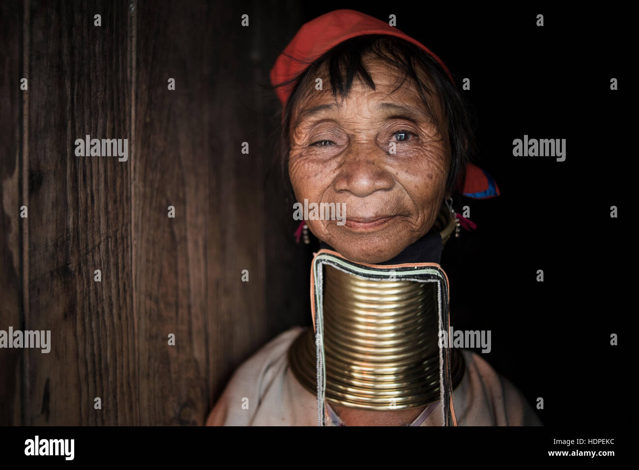 Portrait of a Kayan woman wearing the traditional brass neck rings, Loikaw, Myanmar. Stock Photo