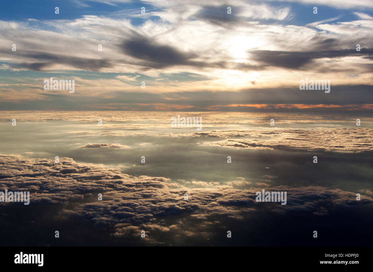 Flying high above clouds sunset hi-res stock photography and images - Alamy