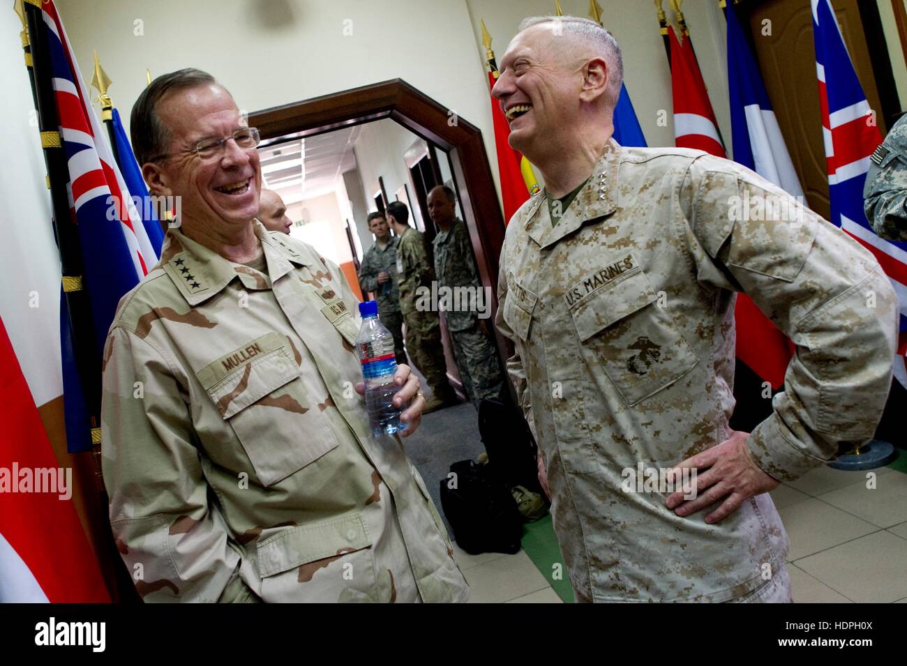 U.S. Joint Chiefs of Staff Chairman Mike Mullen (left) and U.S. Central Command commander James Mattis share a laugh before the International Security Assistance Force change-of-command ceremony at the ISAF Headquarters July 18, 2011 in Kabul, Afghanistan. Stock Photo