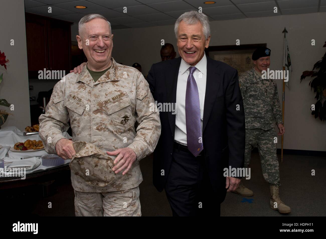 U.S. Marine Corps General James Mattis (left) shares a laugh with Secretary of Defense Chuck Hagel after the U.S. Central Command change-of-command ceremony at the MacDill Air Force Base March 22, 2013 in Tampa, Florida. Stock Photo