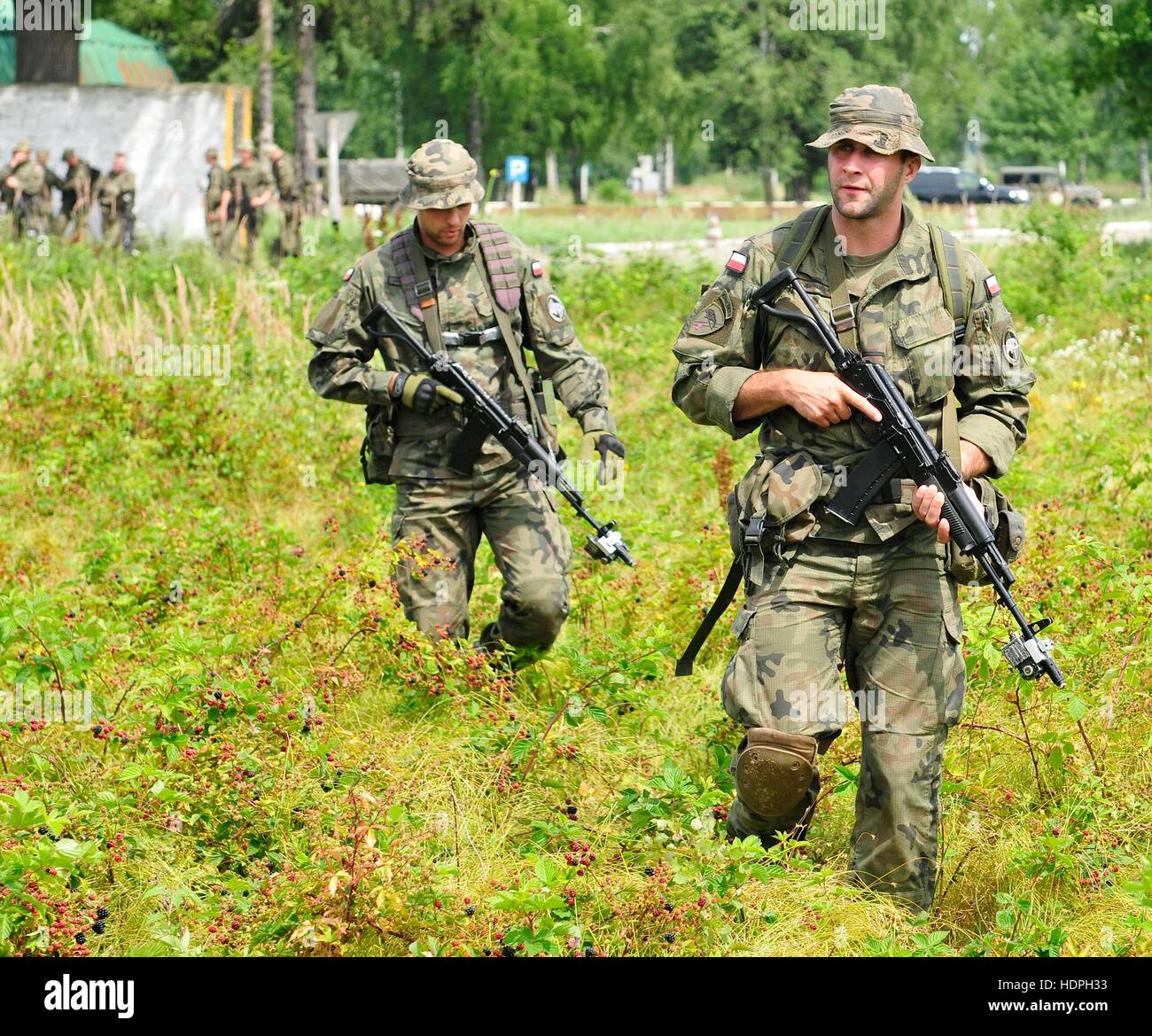 Polish soldiers search for improvised explosive device during a Rapid Trident counter-IED class at the International Peacekeeping and Security Center July 25, 2015 in Yavoriv, Ukraine. Stock Photo