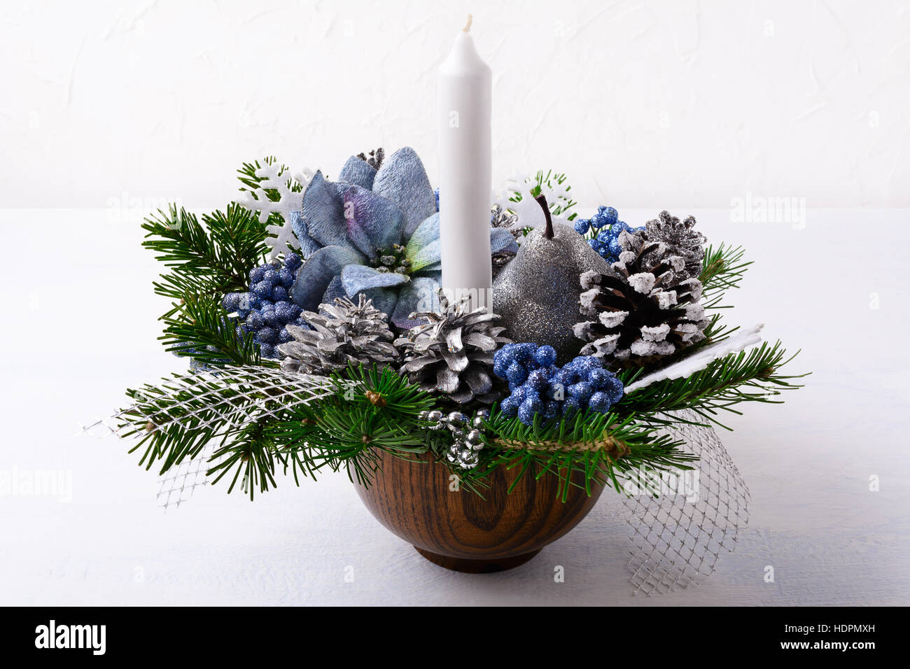 Christmas Decoration With Candle And Blue Silk Poinsettias Stock Photo Alamy