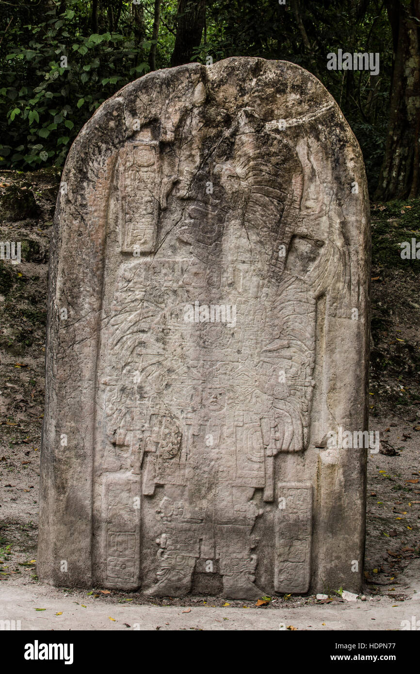 Stela 16 stone carving, circa 711 A.D., shows ruler Hasaw Kan K’awil wearing elaborate ritual dress for the celebration of an important ceremony. Ti Stock Photo
