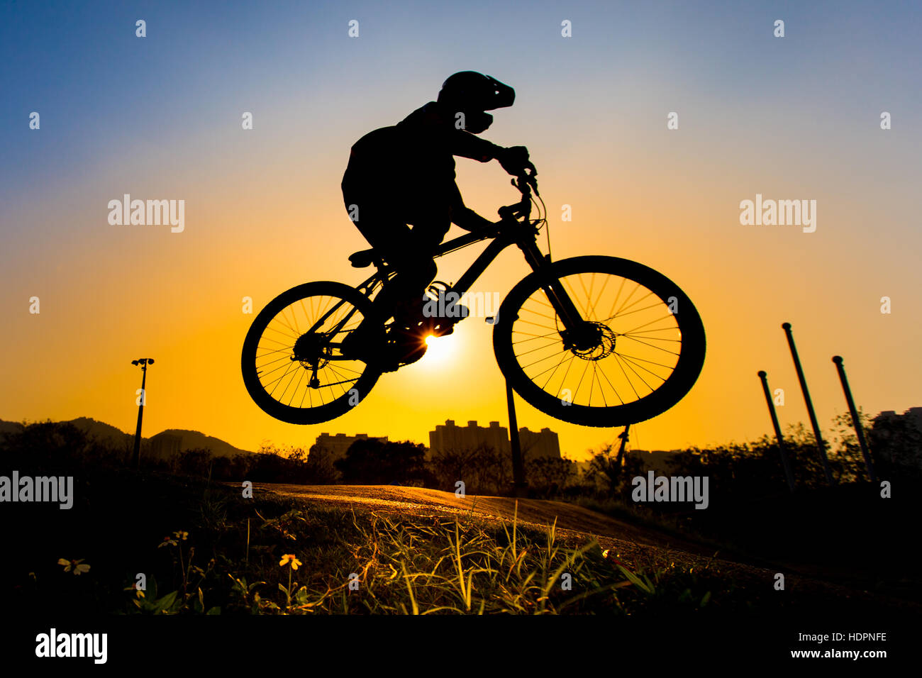 Silhouette Of Stunt Bmx Rider - color tone tuned Stock Photo - Alamy