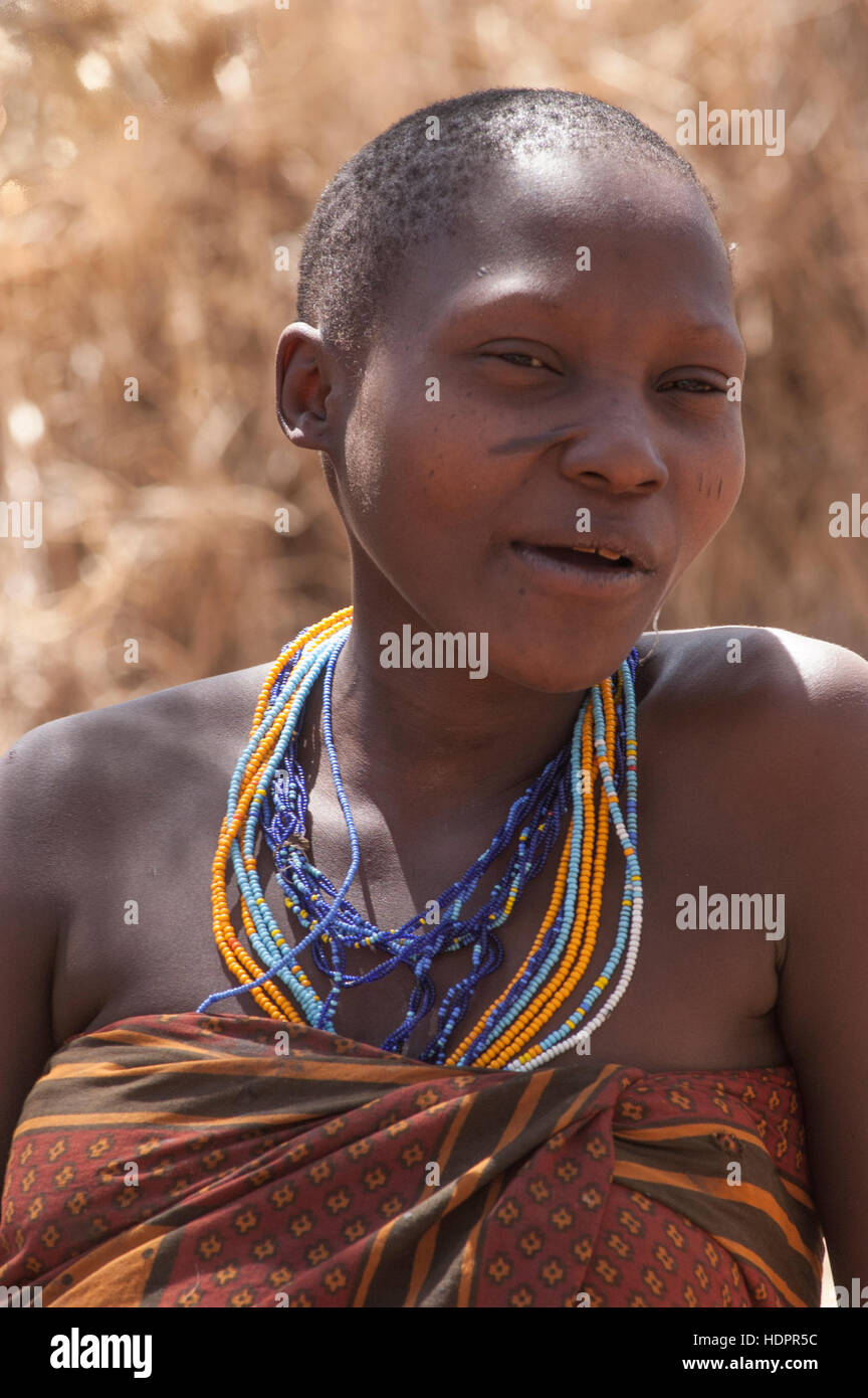 Hadzabe tribeswoman wearing beads, portrait, Lake Eyasi, Tanzania Stock Photo