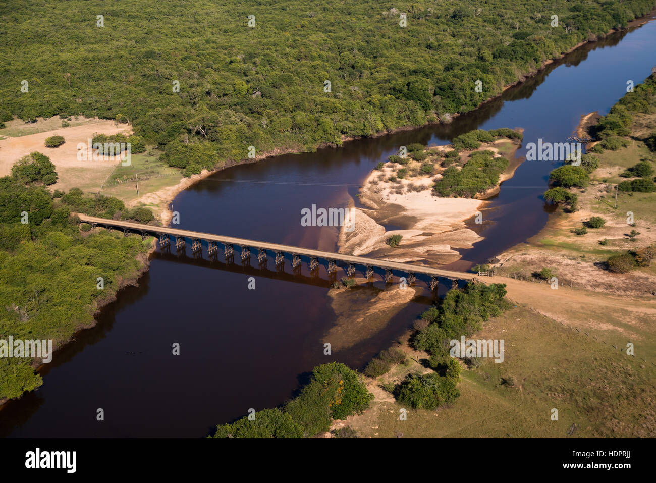 A bridge over the Rio Negro in Mato Grosso do Sul, Brazil, in the heart of the Pantanal, during the dry season. Stock Photo