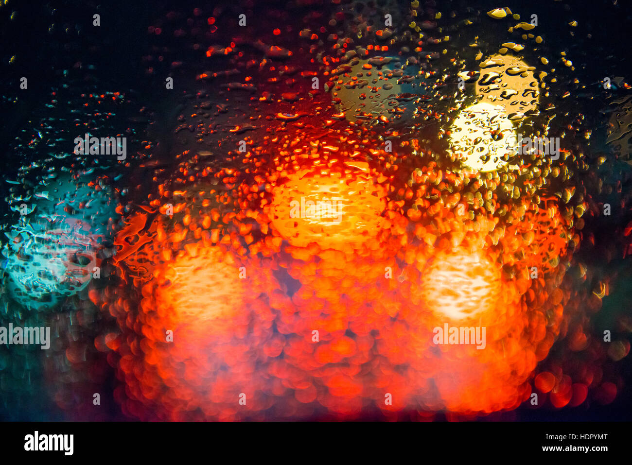 Rain drops on window with street bokeh lights Stock Photo - Alamy