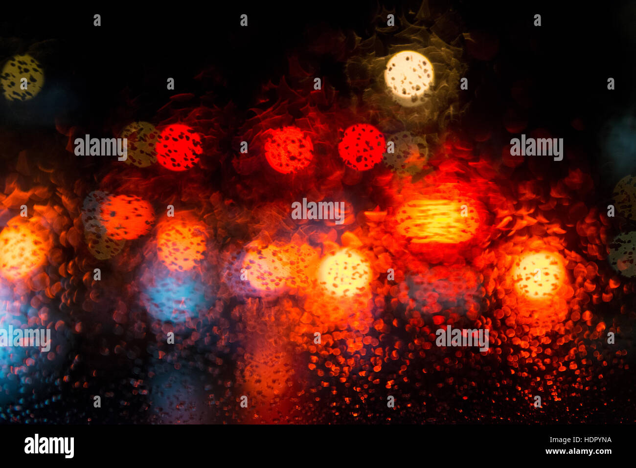 Rain drops on window with street bokeh lights Stock Photo - Alamy