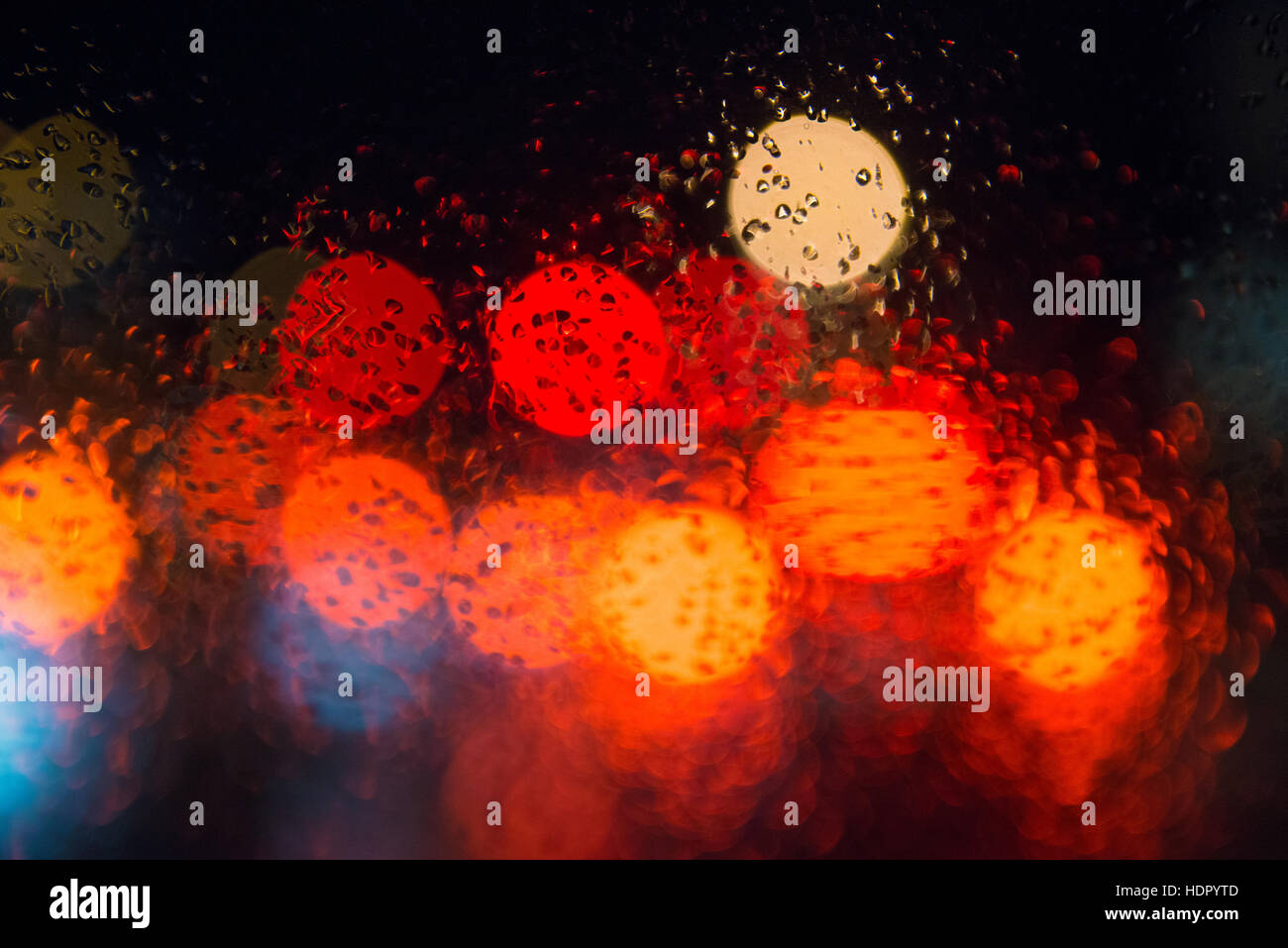 Rain drops on window with street bokeh lights Stock Photo - Alamy