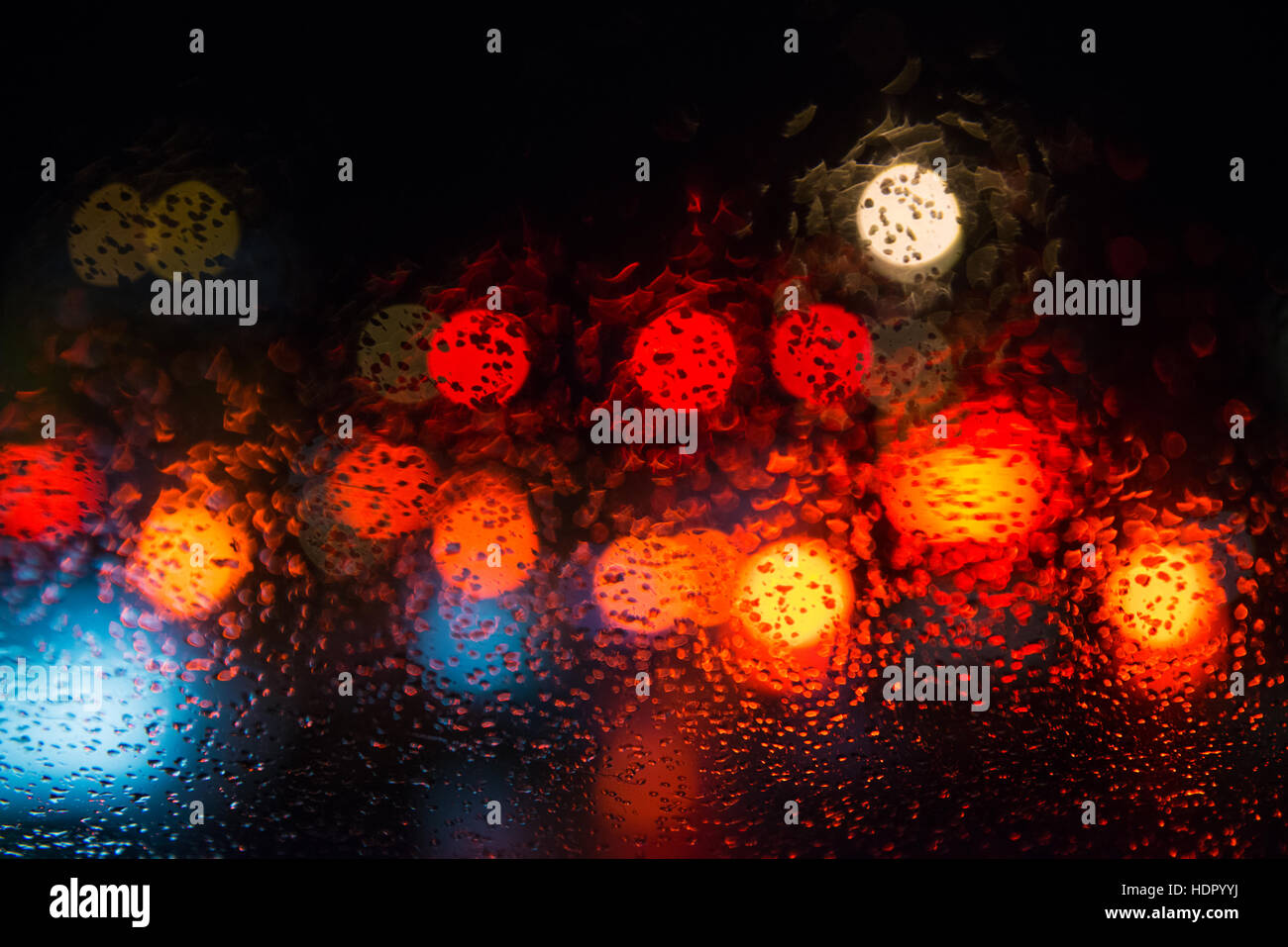 Rain drops on window with street bokeh lights Stock Photo - Alamy