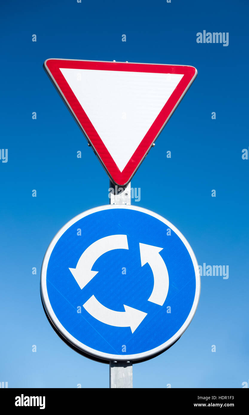 Roundabout and give way sign in Spain Stock Photo Alamy