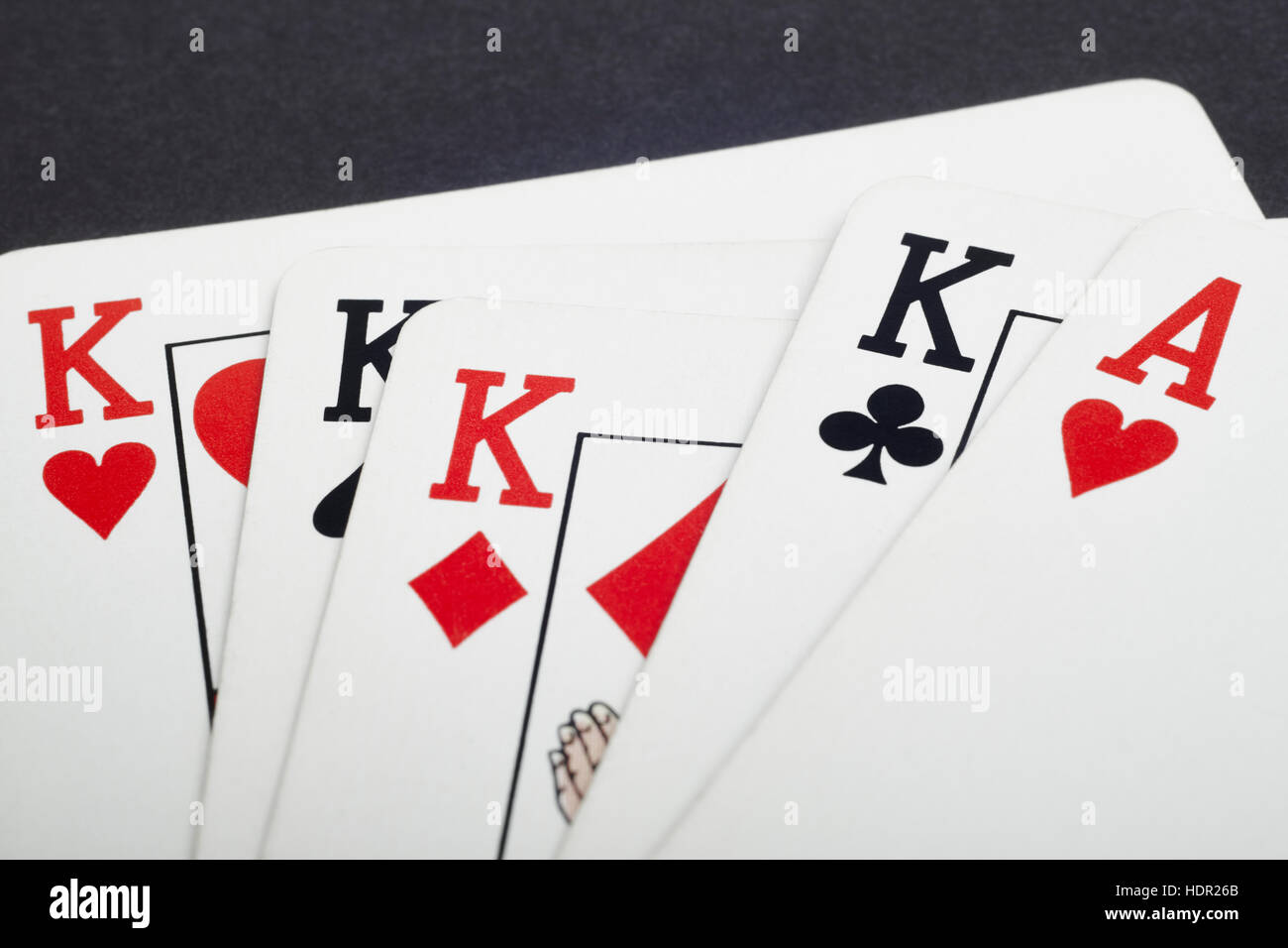 Poker card game with kings and aces full. Black background. Horizontal