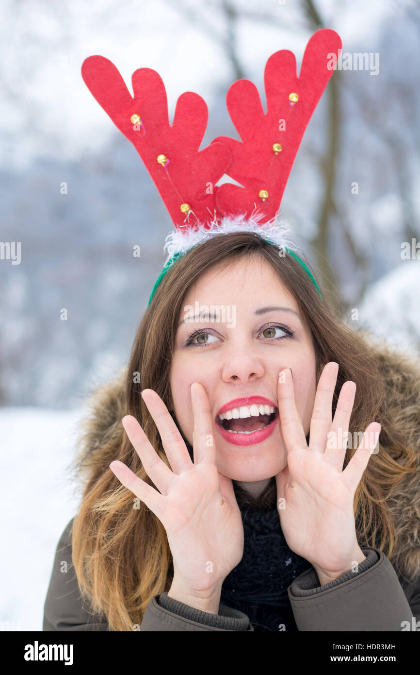 Woman having fun on a cold snowy winter day Stock Photo