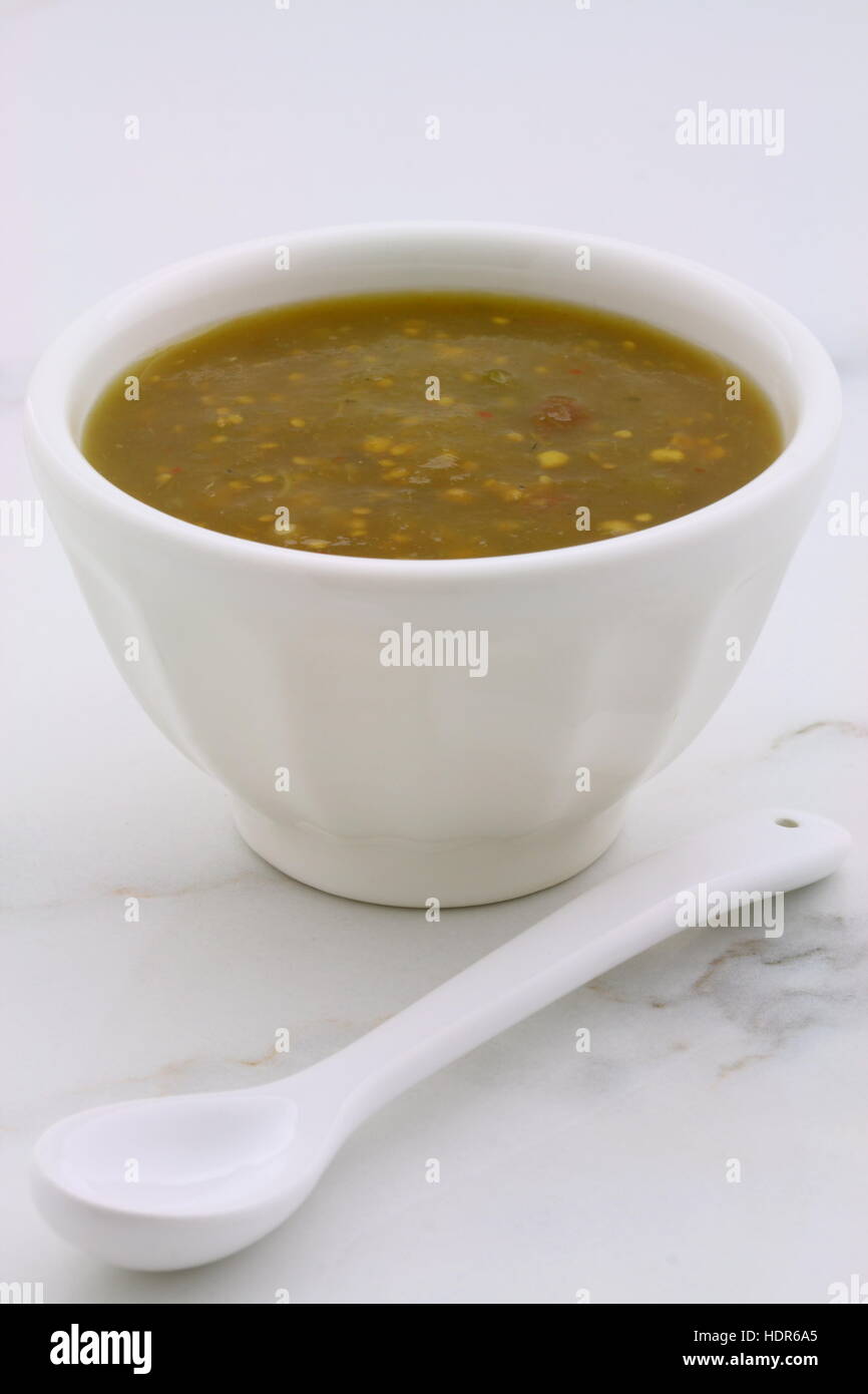 Artisan mexican tomatillo sauce on retro vintage carrara marble setting