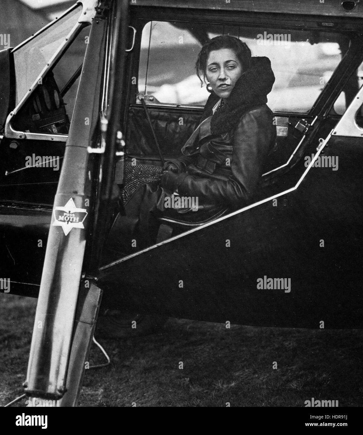 AMY JOHNSON (1903-1941) English aviator preparing for her flight to South Africa from Croydon Airport, near London, in July 1932 in her Puss Moth G-ACAB she named 'Desert Moth' Stock Photo