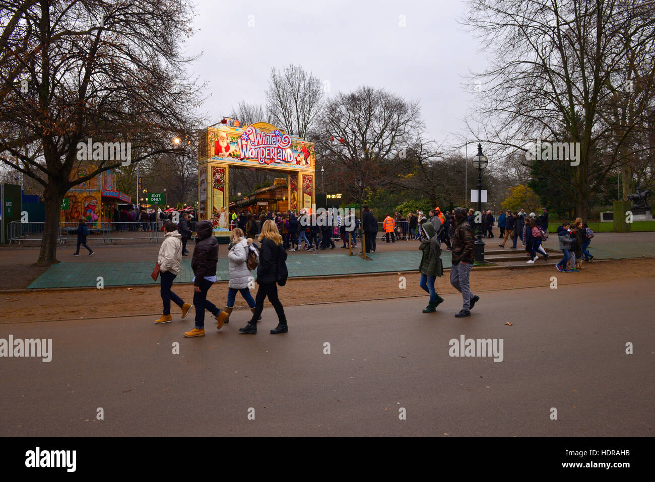 People walking by Winter Wonderland entrance in Hyde Park, London Stock Photo
