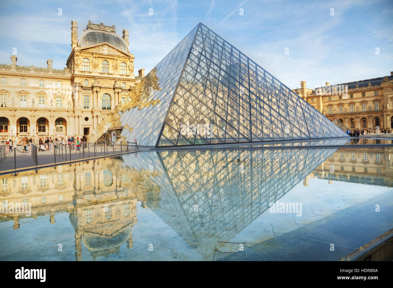 PARIS - NOVEMBER 1: The Louvre Pyramid on November 1, 2014 in Paris, France. It serves as the main entrance to the Louvre Museum. Completed in 1989 Stock Photo