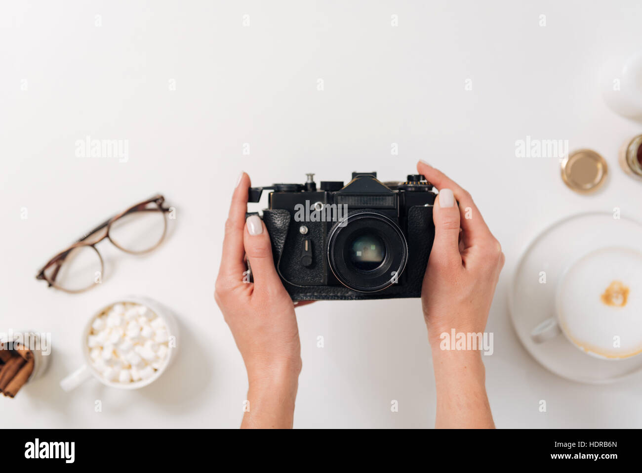 Vintage photo camera being in hands of a female photographer Stock Photo