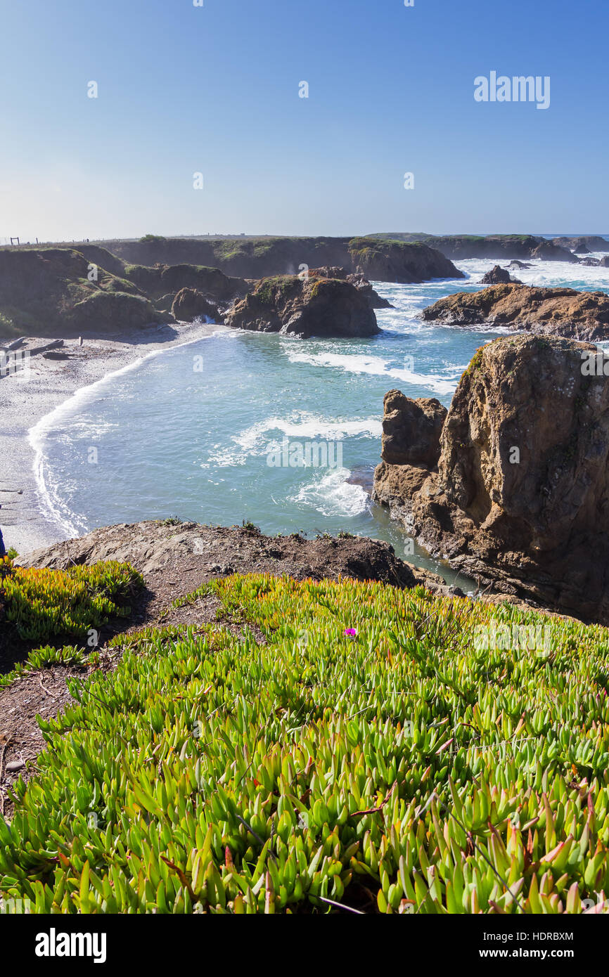 glass beach in Fort Bragg California with blue skies reflecting on the