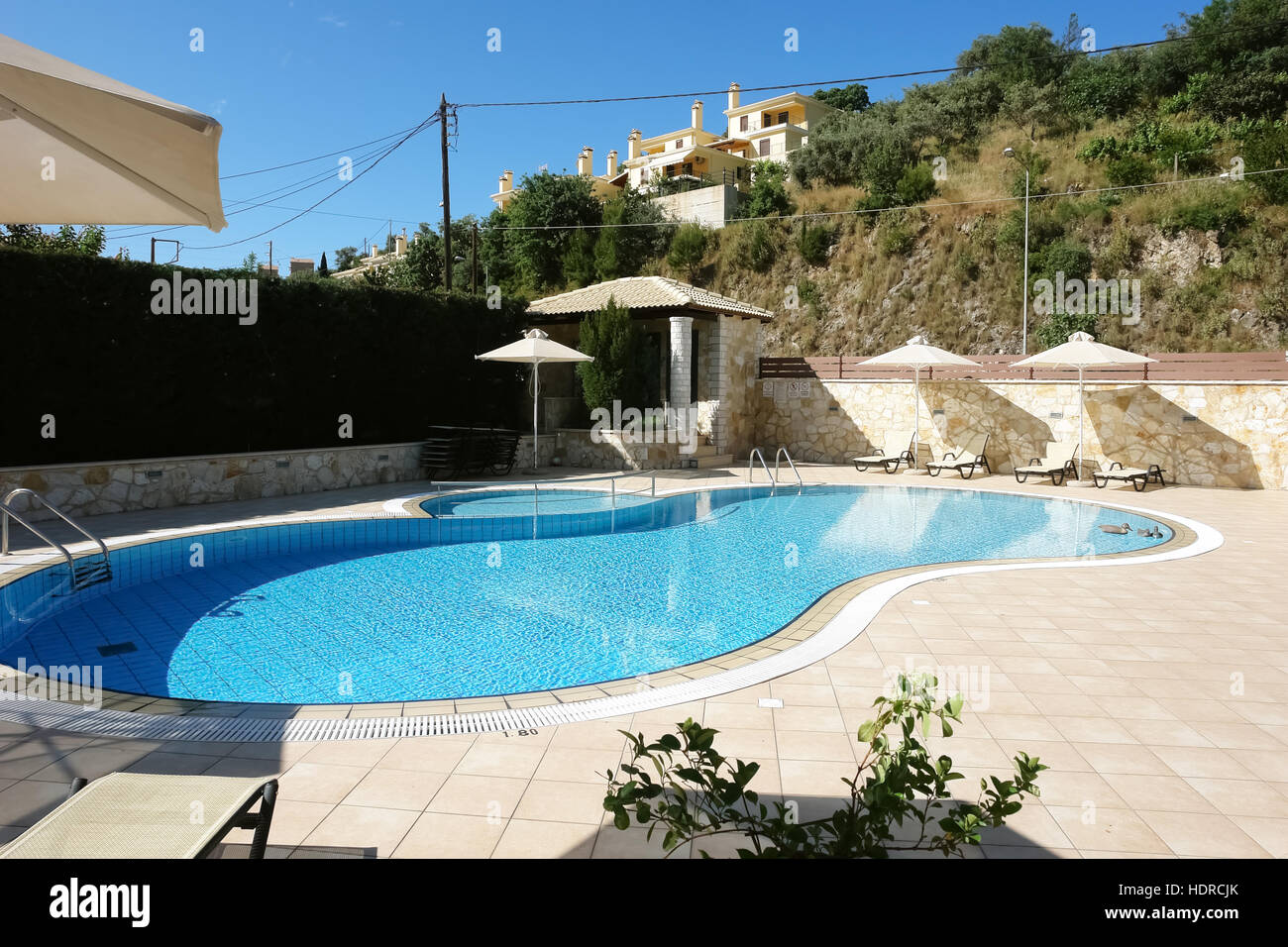Sivota Greece May 09 2013 View On Blue Swimming Pool And Umbrellas