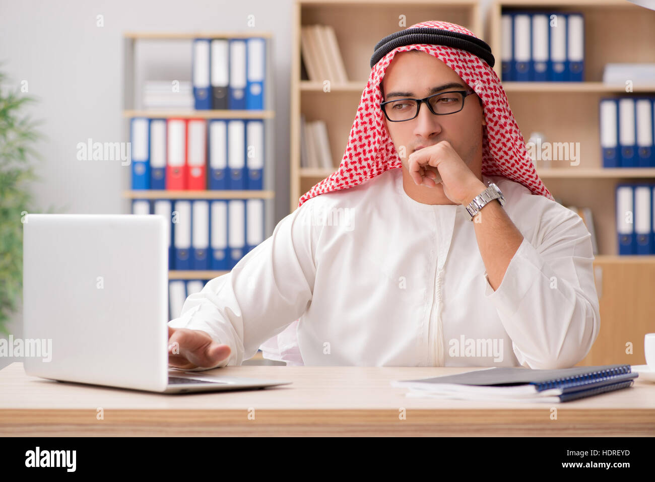 Arab businessman working in the office Stock Photo - Alamy