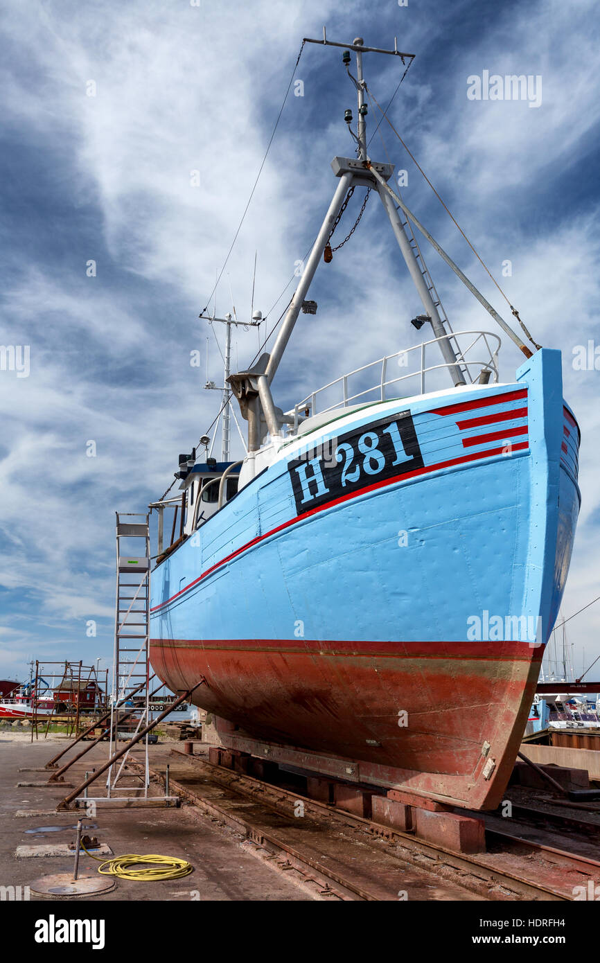 Traditional Danish fishing boat in a ship repair yard, Gilleleje, Denmark Stock Photo