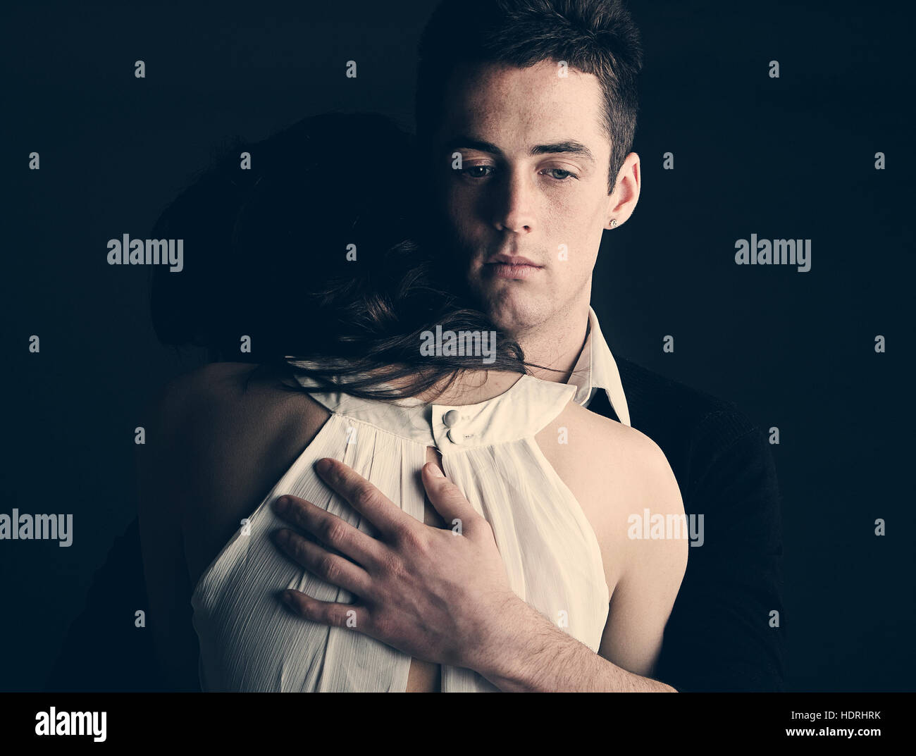 Powerful shot of a young couple embracing Stock Photo