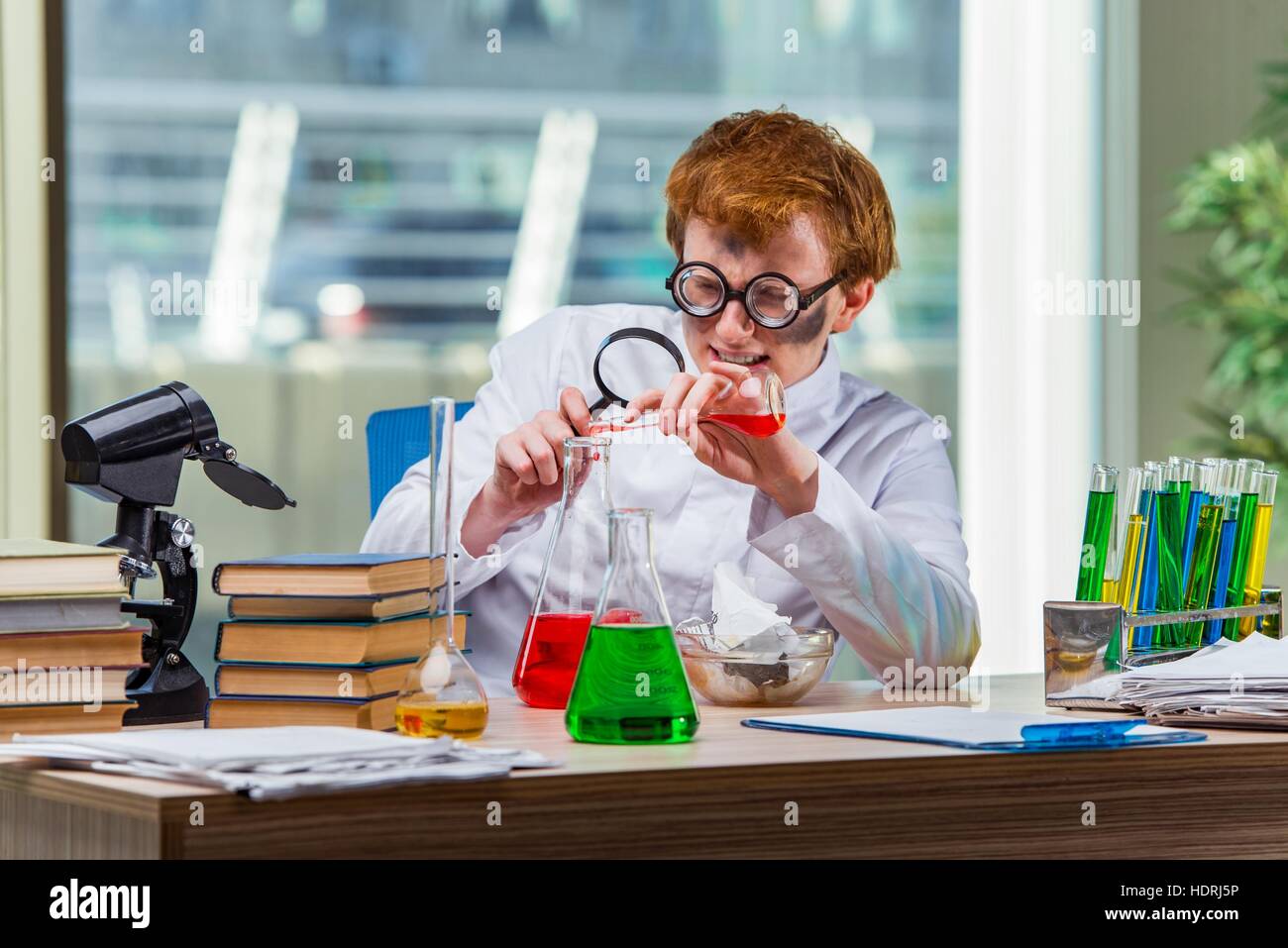 Young crazy chemist working in the lab Stock Photo - Alamy