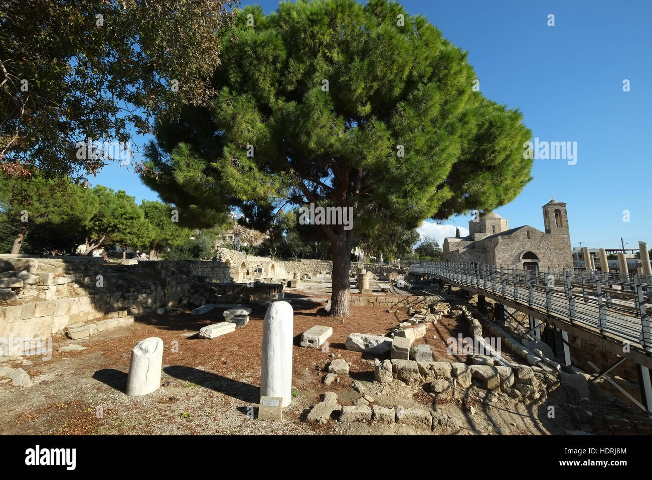 St Pauls Pillar, Paphos, Republic of Cyprus with Agia Kyriaki in background Stock Photo