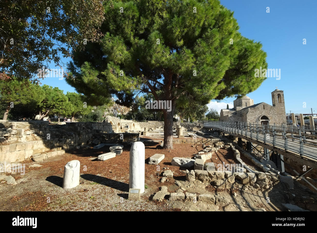 St Pauls Pillar, Paphos, Republic of Cyprus with Agia Kyriaki in background Stock Photo