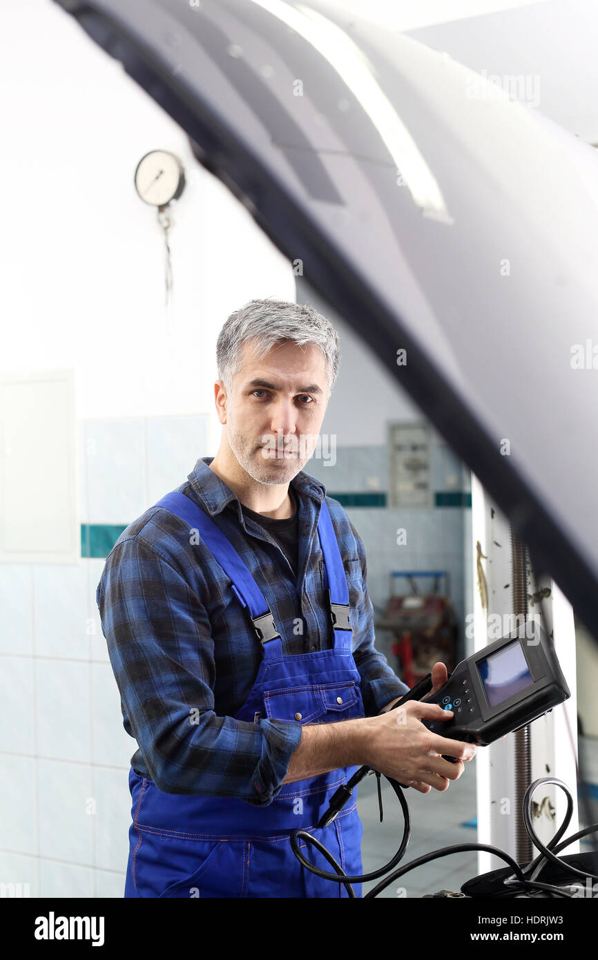 Diagnostic station, mechanic connected diagnostic computer. Technical
