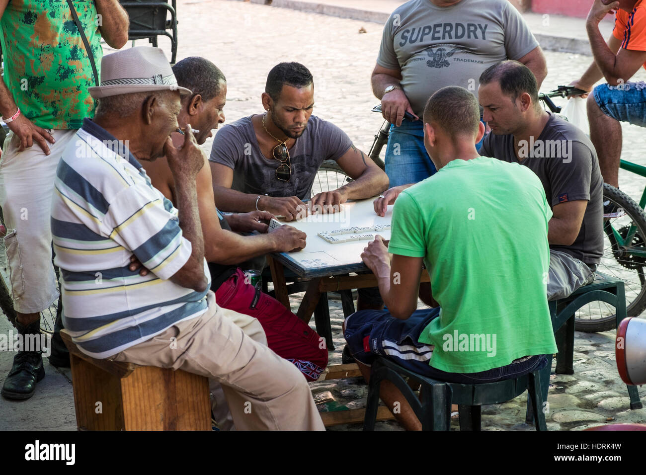 Playing a game of dominoes in the street, Trinidad, Cuba Stock Photo