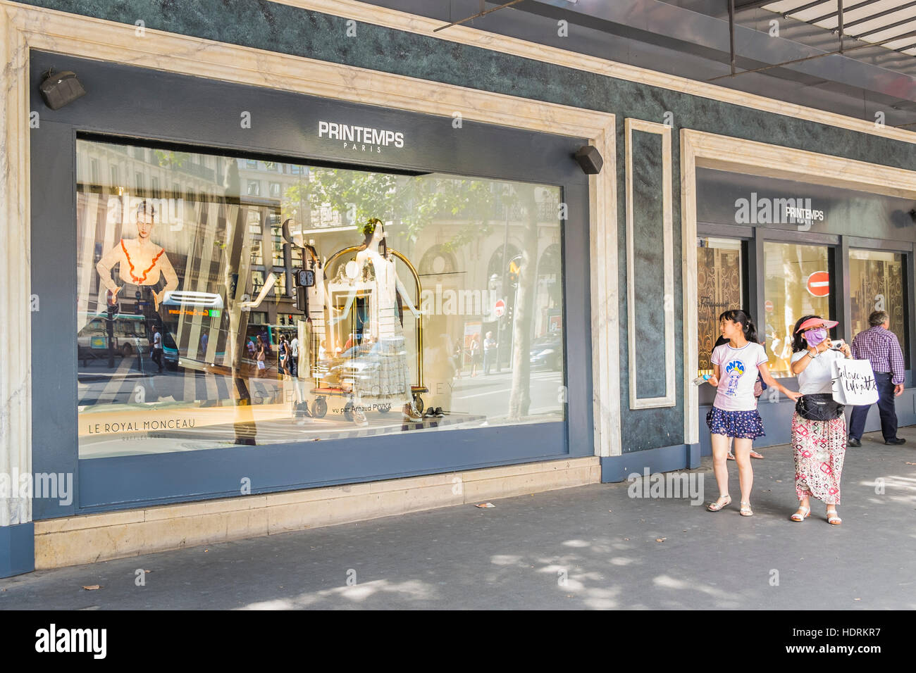 street scene in front of shop window of printemps department store Stock Photo