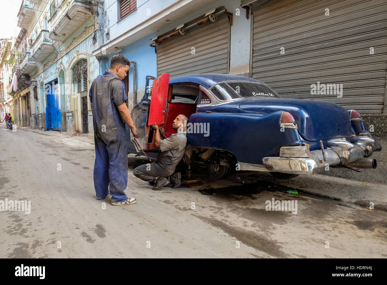 Car repairs on the street in La Havana, Cuba. Stock Photo
