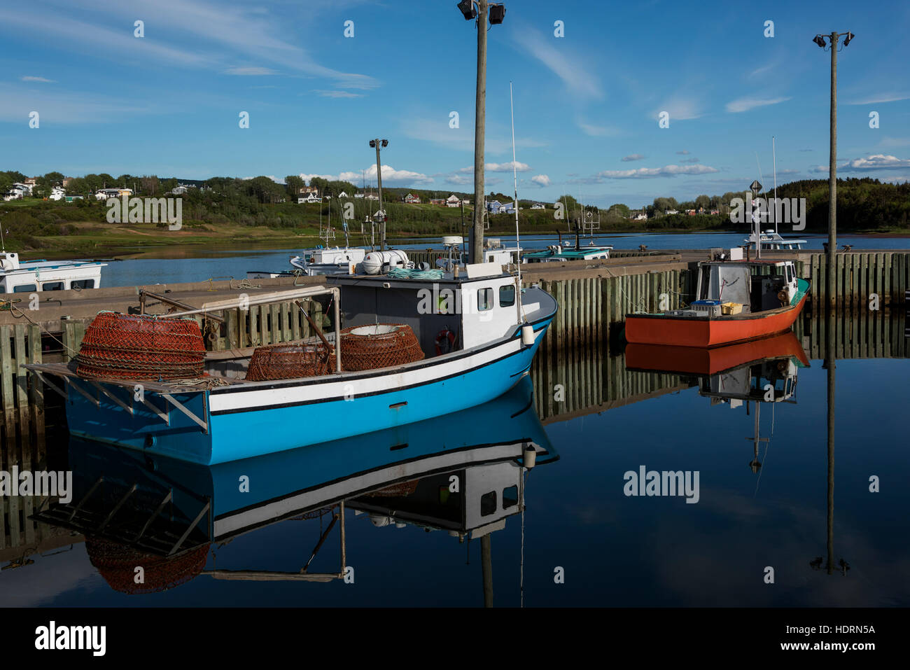 Fishing boats in the tranquil harbour; Mabou, Nova Scotia, Canada Stock Photo