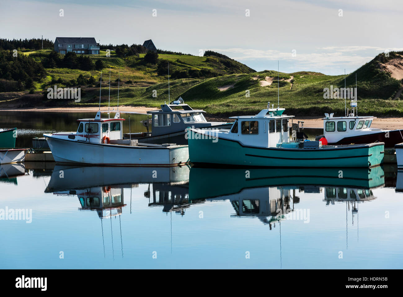Fishing boats in the tranquil harbour; Mabou, Nova Scotia, Canada Stock Photo