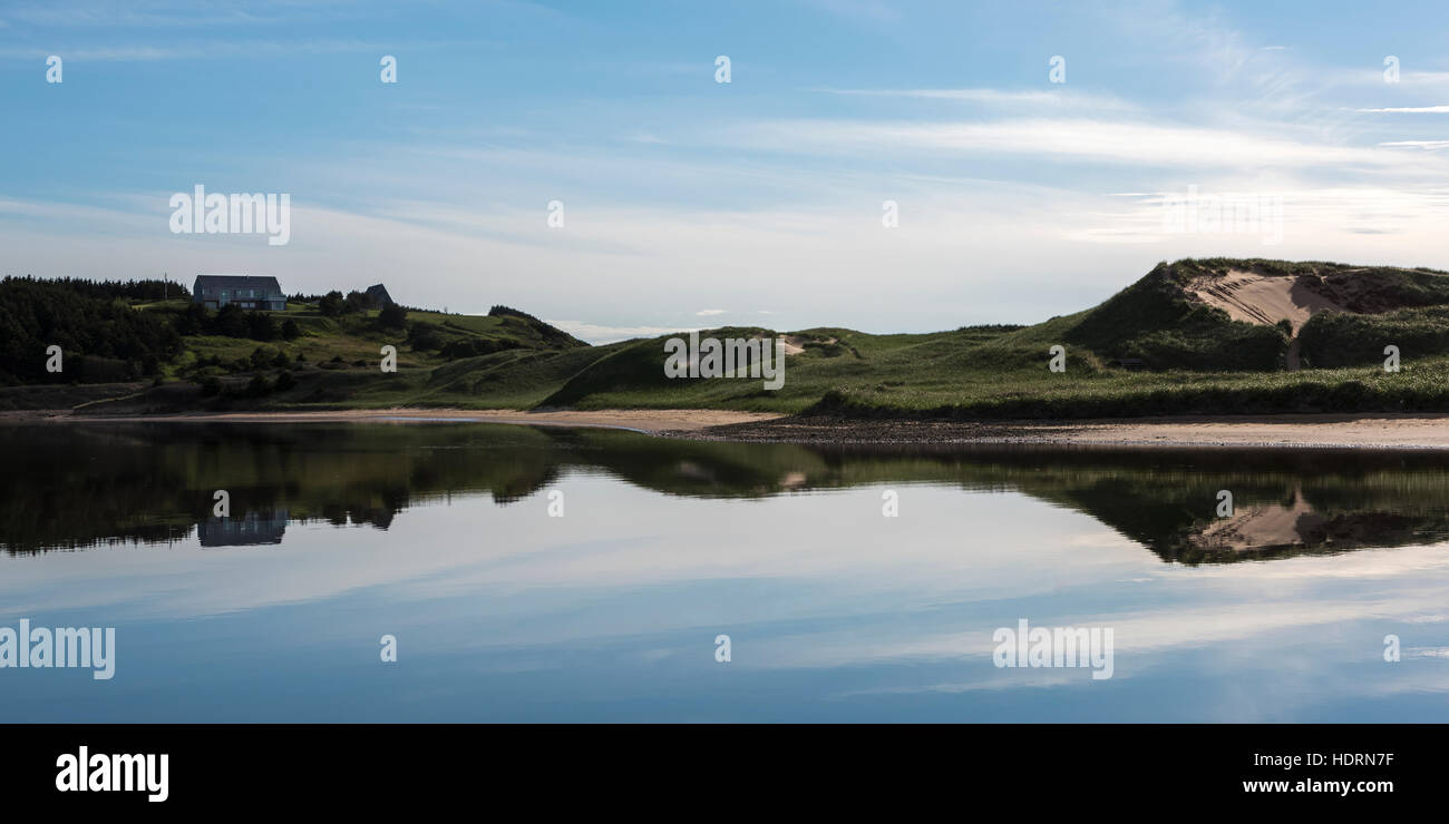 Mirror reflection of the landscape along the Atlantic coast; Mabou, Nova Scotia, Canada Stock Photo