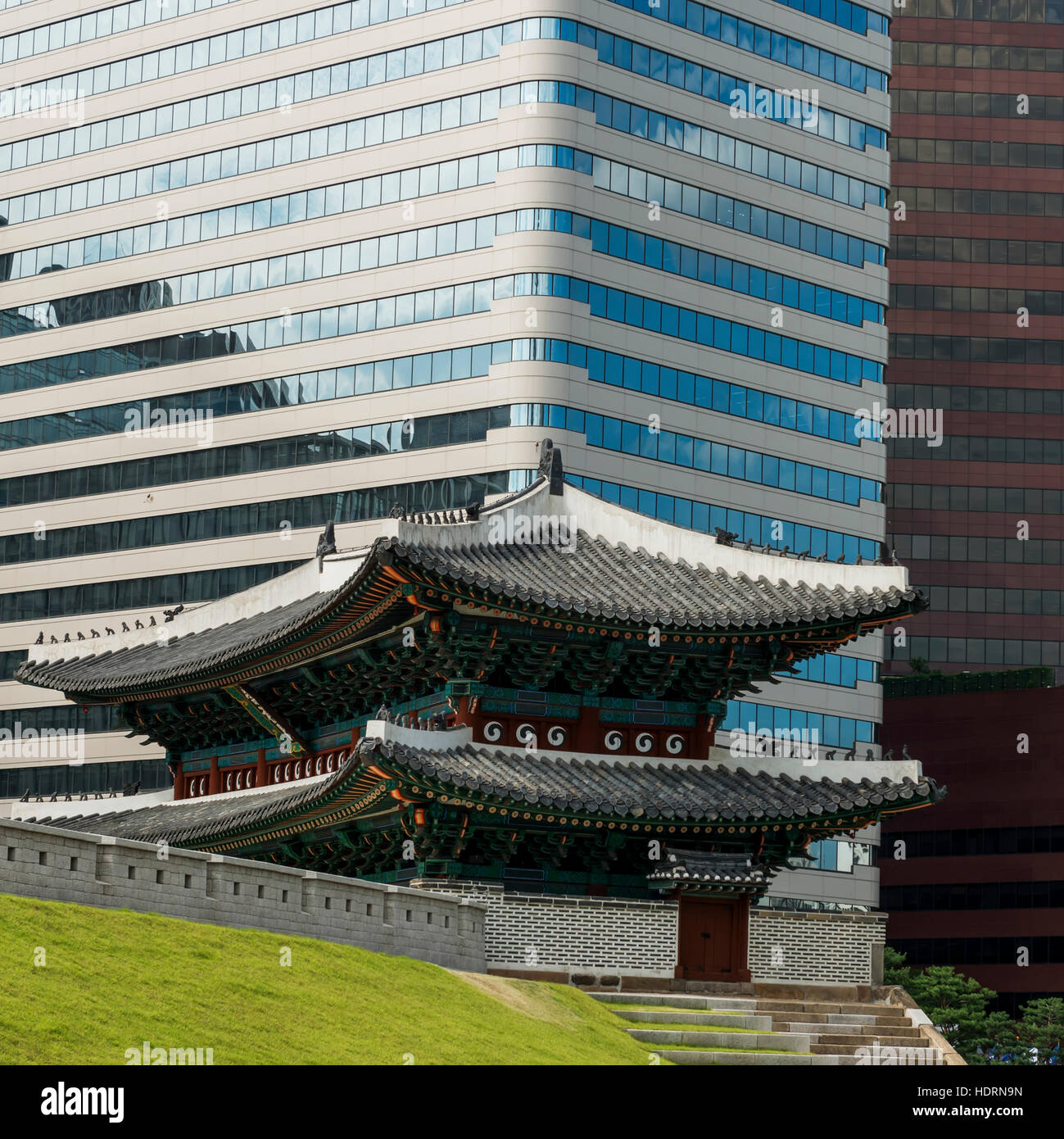 A modern office building and building of traditional Korean architecture; Seoul, South Korea Stock Photo