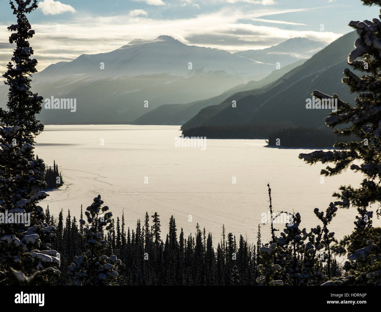 Frozen Muncho Lake in winter, Muncho Lake Provincial Park; British Columbia, Canada Stock Photo