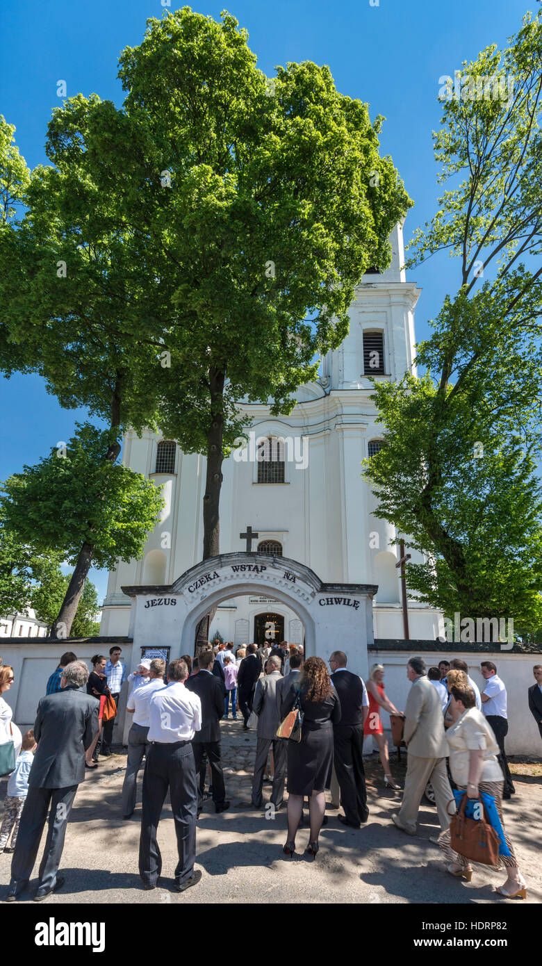 Norbertine Church, baroque style, Sunday Mass crowd, in village of Witow near Piotrkow Trybunalski, Western Mazovia, Poland Stock Photo