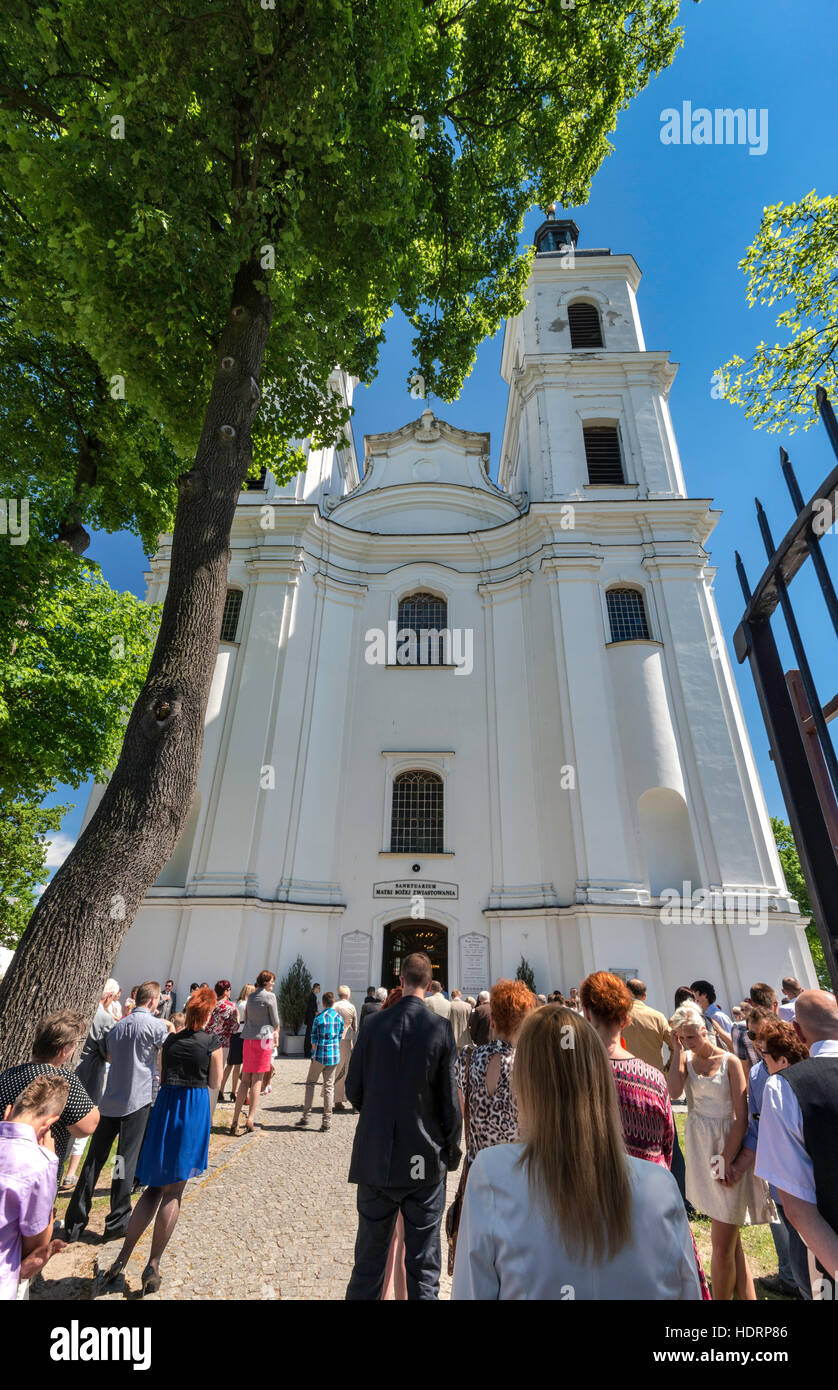 Norbertine Church, baroque style, Sunday Mass crowd, in village of Witow near Piotrkow Trybunalski, Western Mazovia, Poland Stock Photo