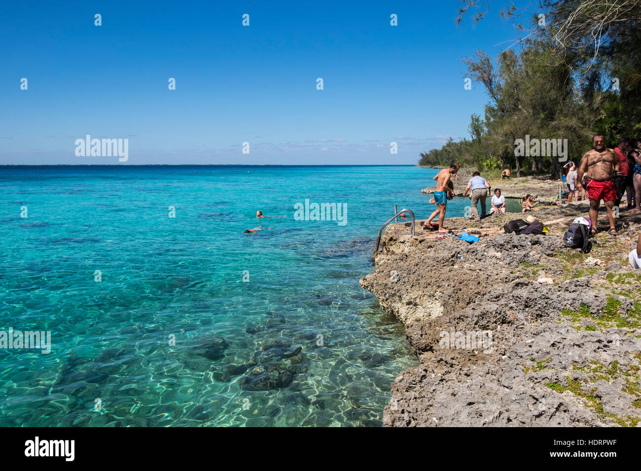 Swimmers along the Caribbean coast at Playa Giron, Bay of Pigs, Cuba Stock Photo