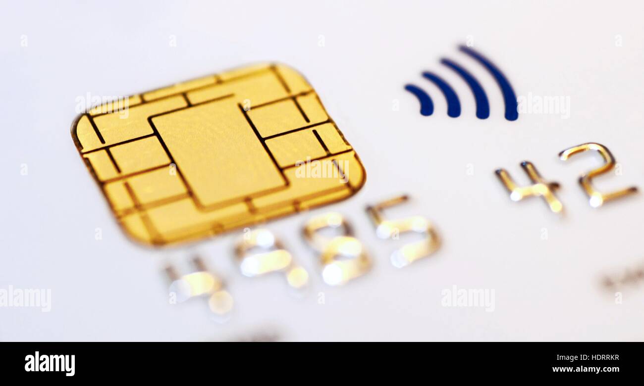 White credit card with closeup of a chip and contactless symbol. Macro