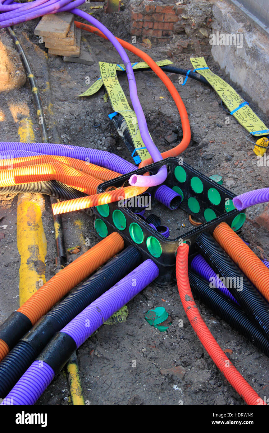 Multicoloured pipes for wiring underground Stock Photo Alamy