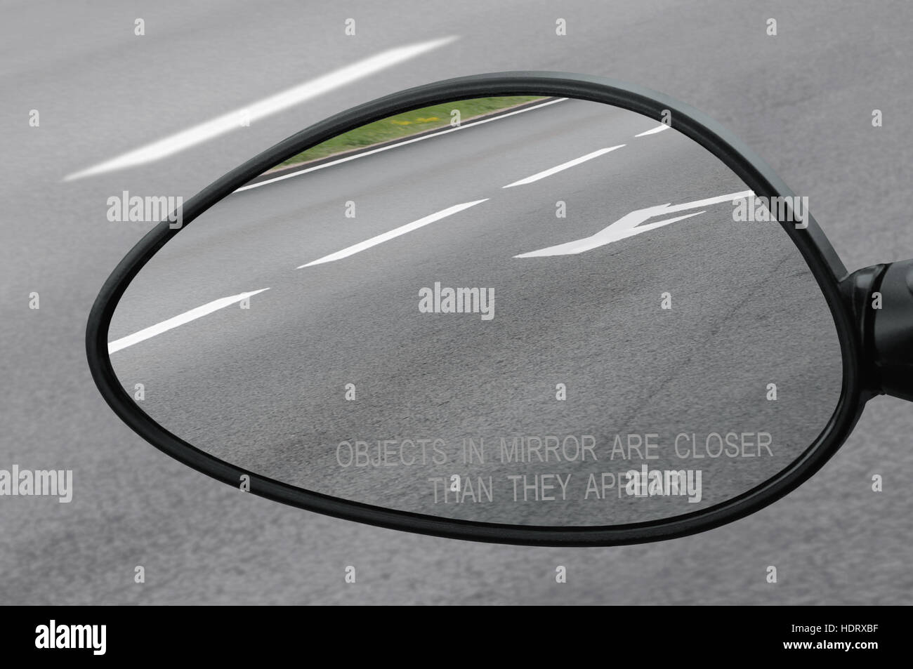 Rear view mirror with warning text objects in mirror are closer than